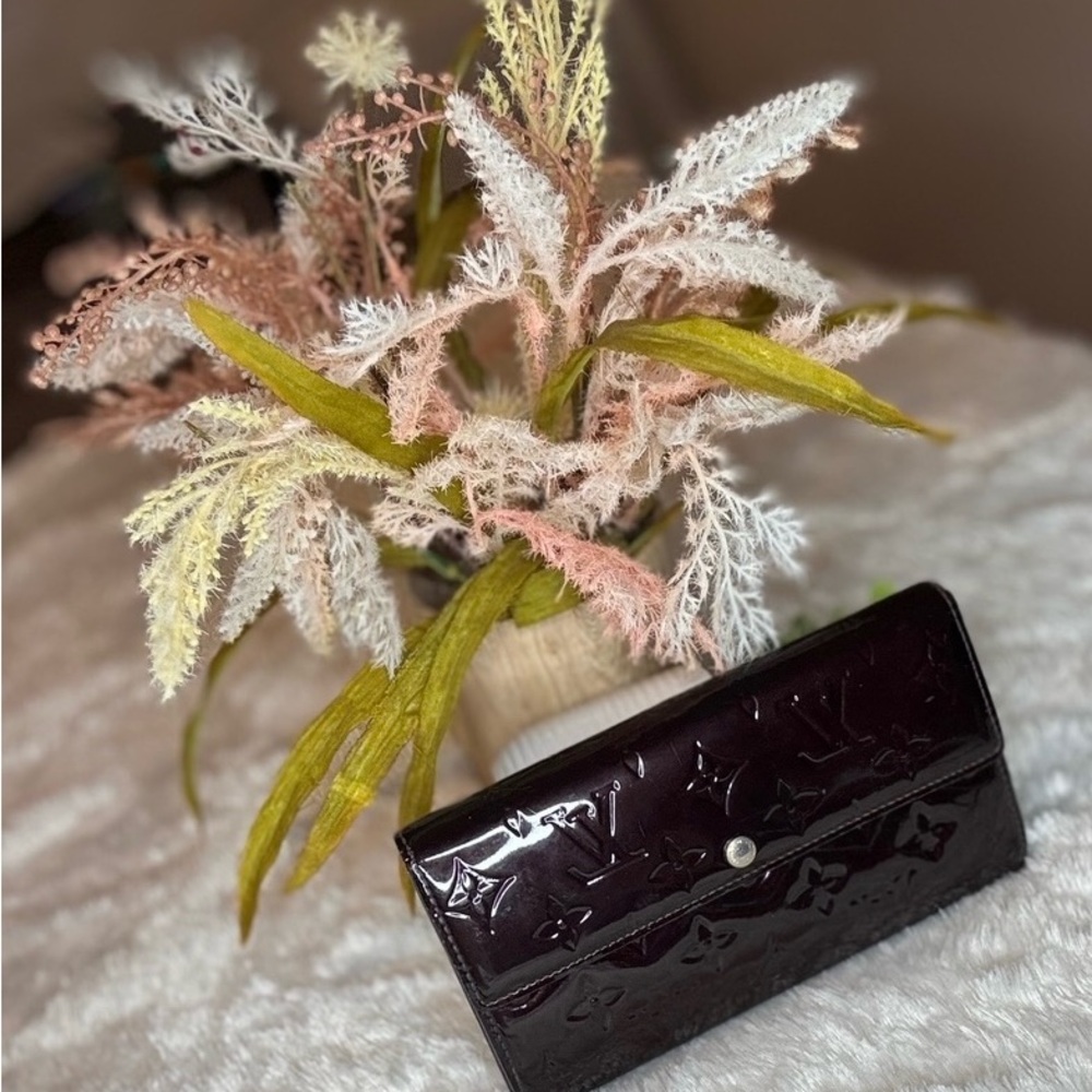 Louis Vuitton dark Purple Wallet with Embossed Texture and Rectangular Shape